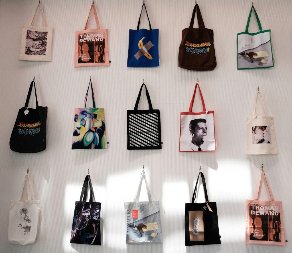 a bunch of bags hanging on a wall